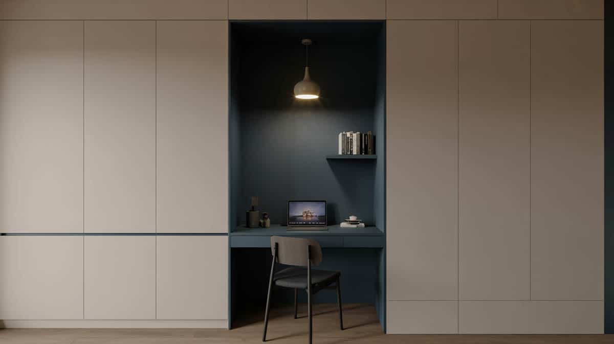 Small home office niche with deep navy blue accent wall, floating desk, and Scandinavian minimal styling