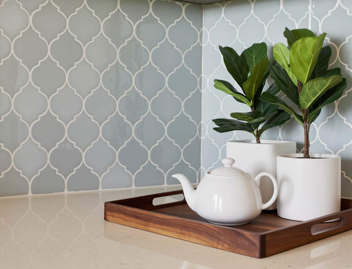 arabesque backsplash in light blue glass