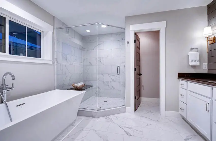Bathroom with marble shower and bench