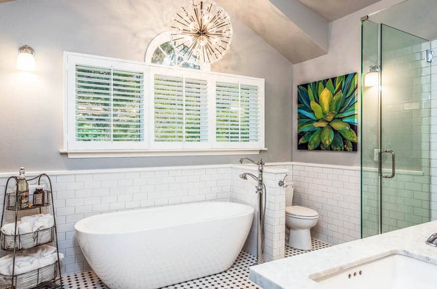Bathroom with white subway tile wainscoting and gray wall paint