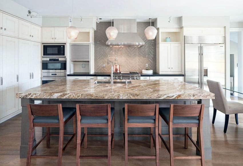 Contemporary kitchen with white main cabinets, brown quartz island, and black quartz countertops with porcelain tile backsplash