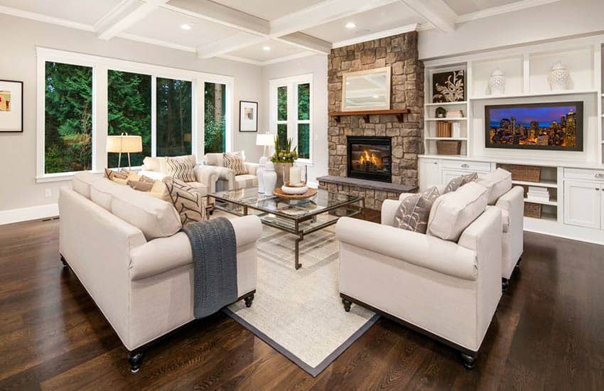 Contemporary living room with fabric sofa, seats and coffered ceiling