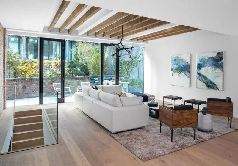 Contemporary living room with unfinished faux wood ceiling