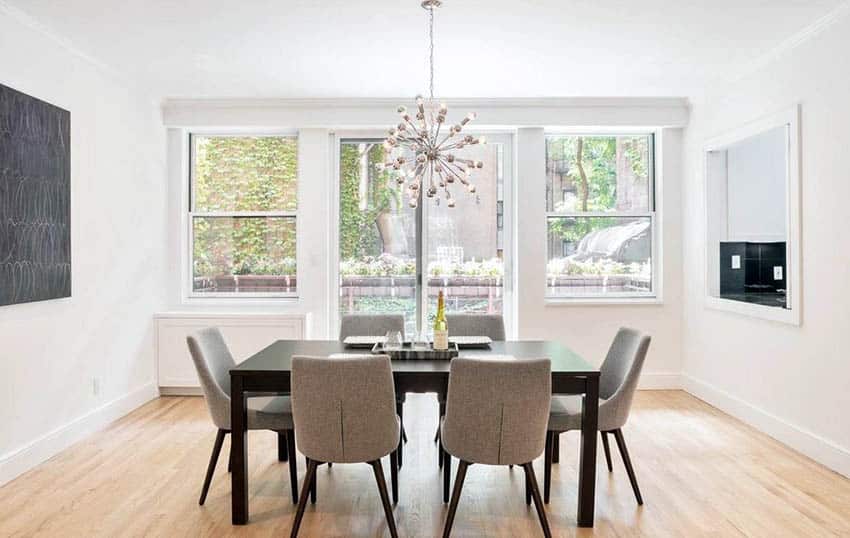 Dining room with sputnik chandelier and six-chair dining set