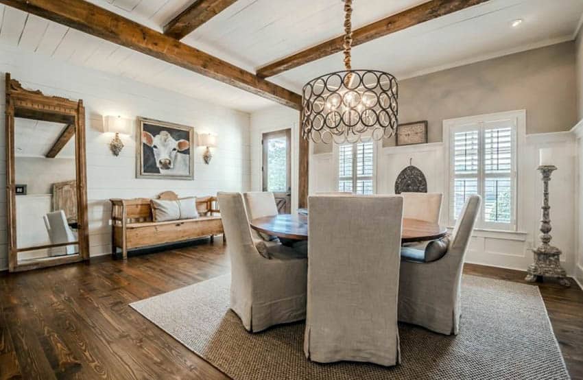 Dining room with shiplap ceiling and wood beams