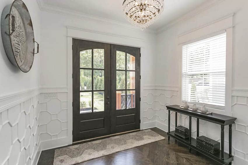 Entryway with modern wainscoting with geometric design