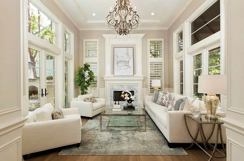 Formal living room with off white fabric sofa and seats