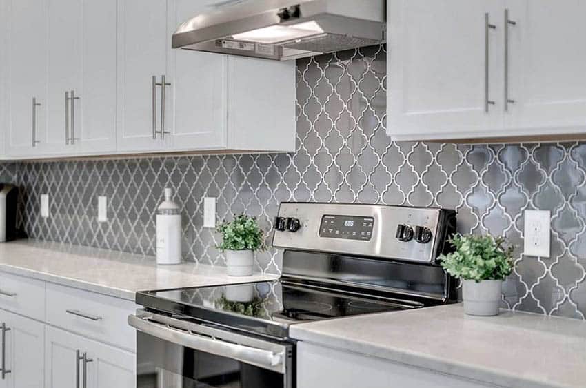 Kitchen with gray arabesque tile backsplash