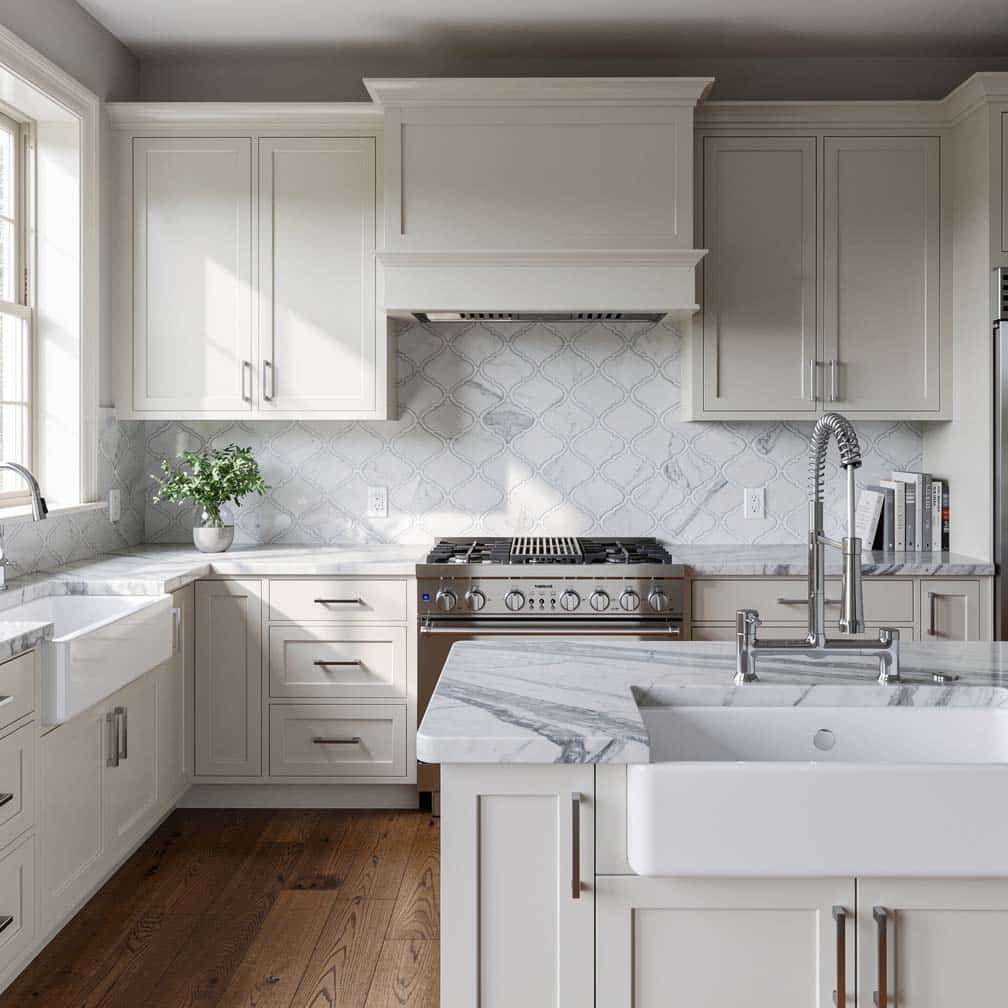 Kitchen with white cabinets and arabesque backsplash tile above stove top