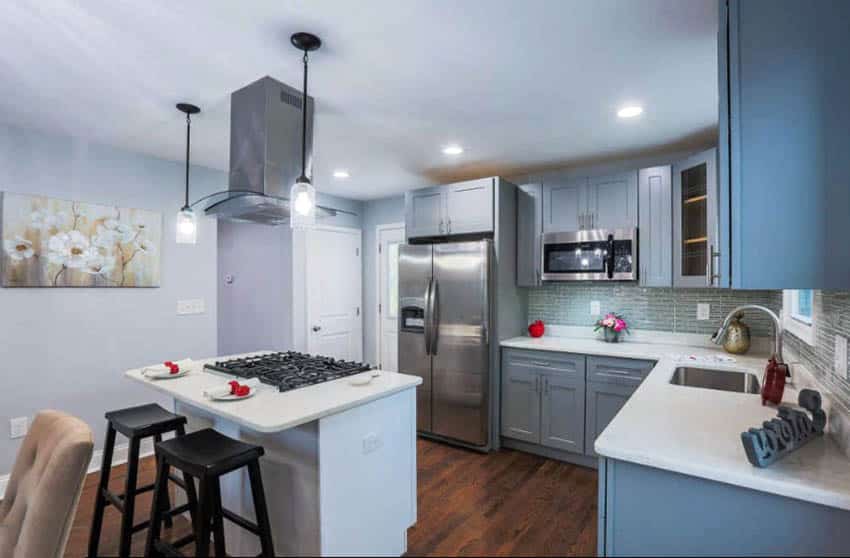 Kitchen with gray cabinets light gray paint and blue tile backsplash