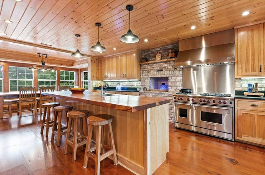 Kitchen with hickory cabinets and pine flooring