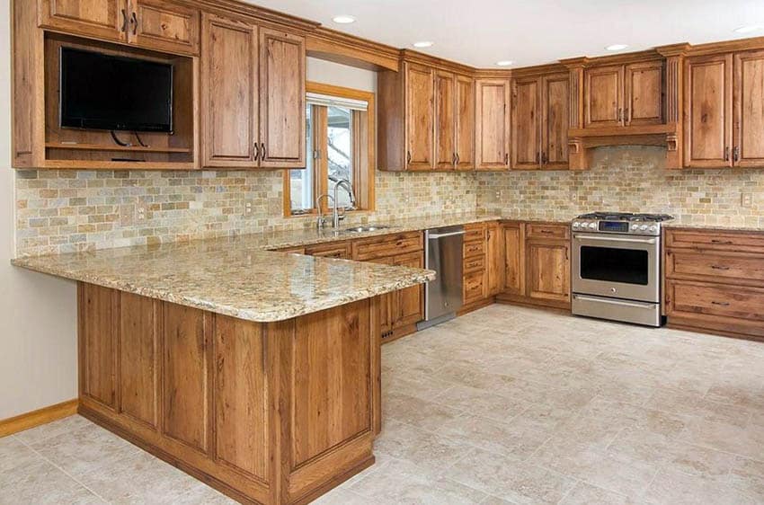 Kitchen with hickory cabinets and tile flooring