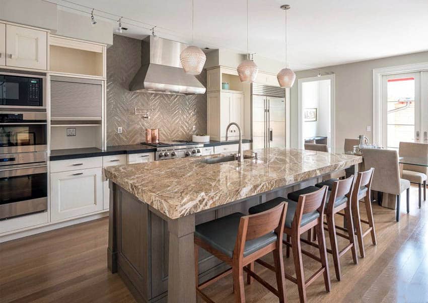 Kitchen with brown quartz counter, soapstone and textured backsplash