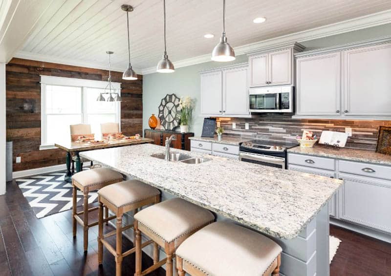 Kitchen with brown wood accent wall, mint wall paint and shiplap ceiling