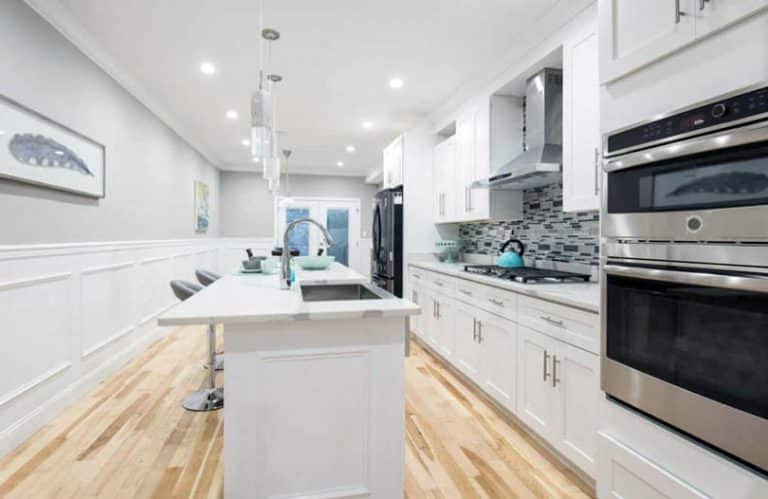 grey wainscotting white wall kitchen