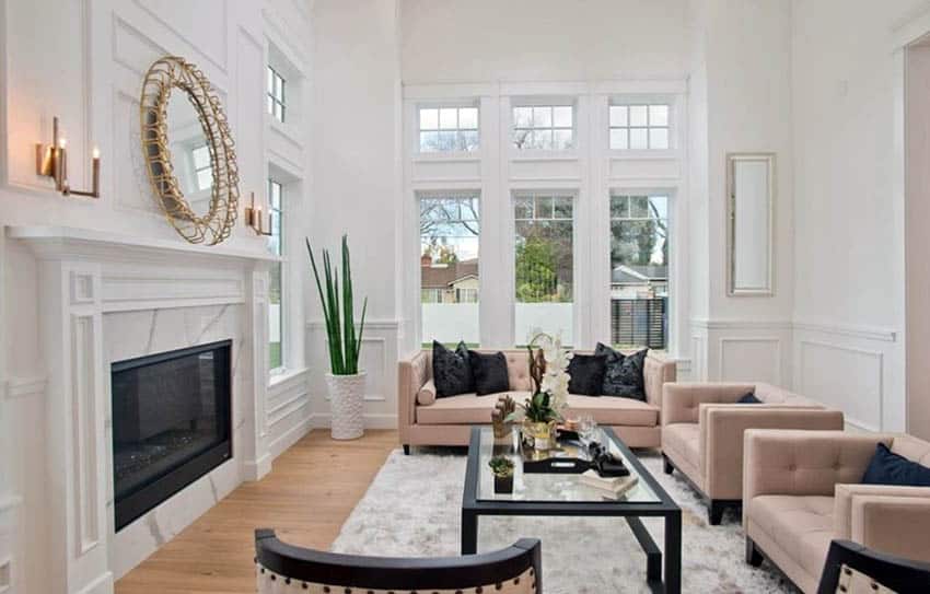 Living room with white wall wainscoting and high ceilings