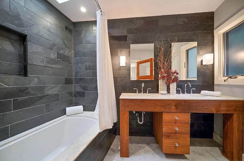 Master bathroom with alcove tub and shower combination and slate wall tile