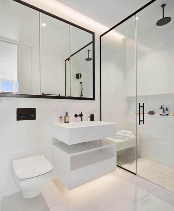 Black and white bathroom with floating ledge to sit on