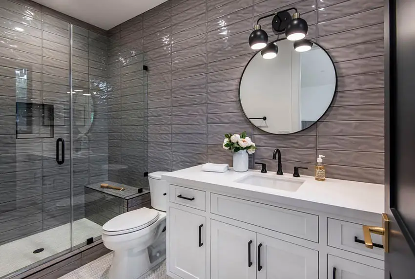 Small shower with mirror bench and textured wall tile