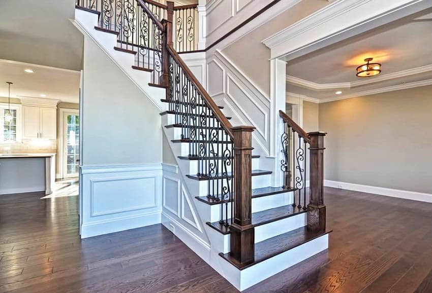 Stairs with wainscoting wrought iron stair rail