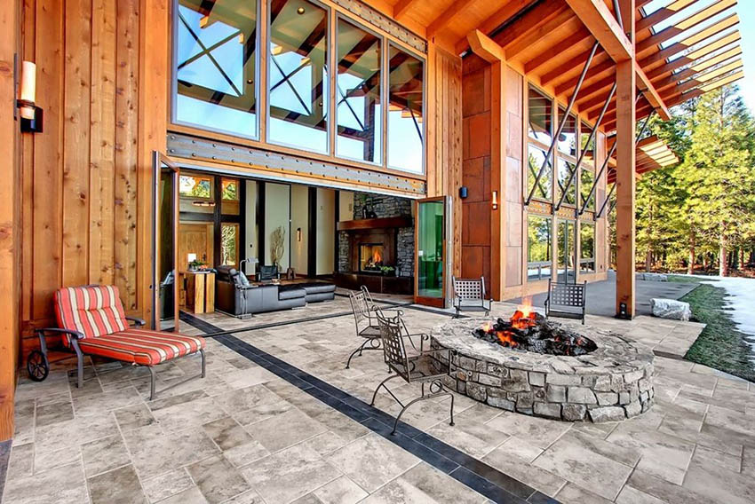 Stamped concrete patio with firepit and indoor outdoor living room