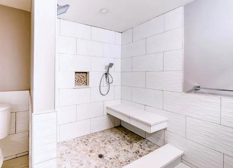 Tile walk in shower with floating bench
