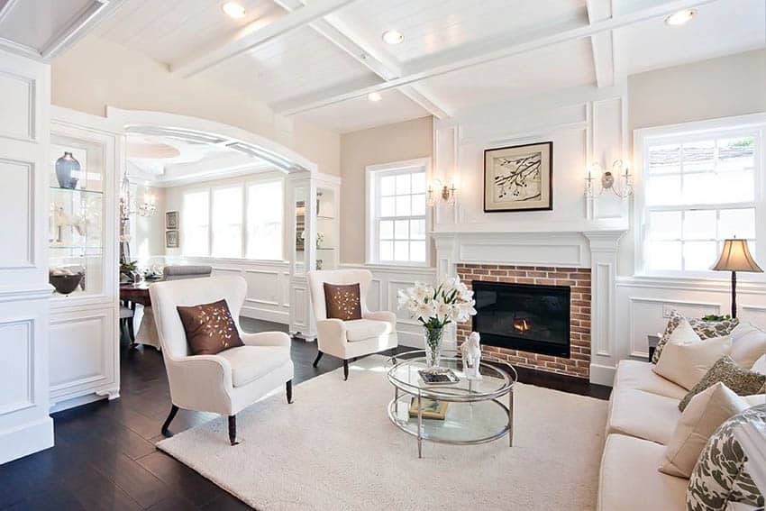 Traditional living room with wainscoting, coffered ceiling and brick fireplace