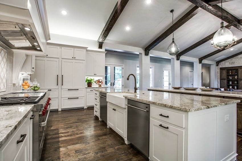 Transitional kitchen with wood beam ceiling, giallo atlantico granite countertops and white cabinets
