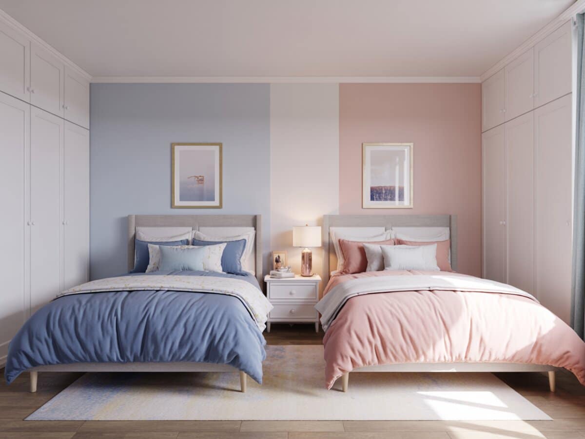 Two twin beds side by side in soft blue and blush bedding