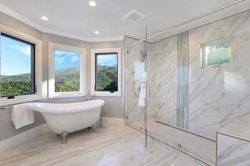 Bathroom with wraparound windows and tub with clawfoot design