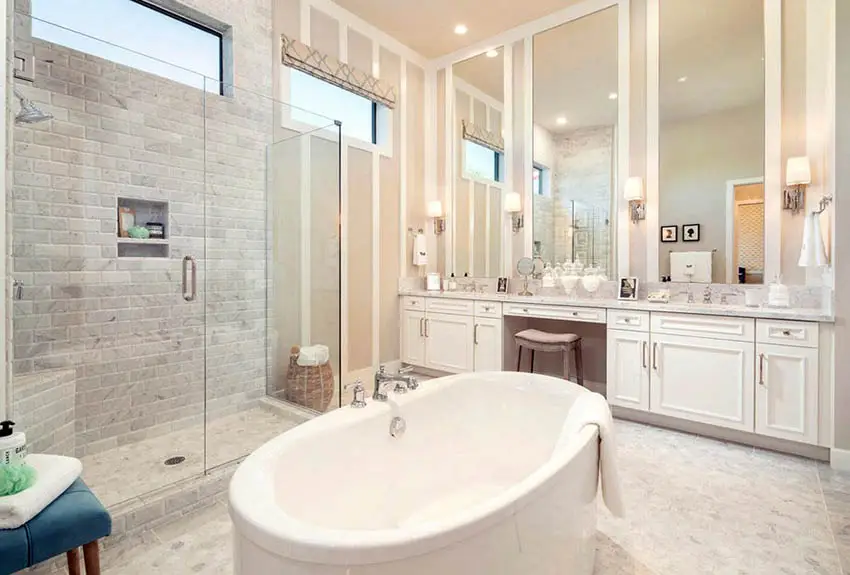 Bathroom with high ceilings, a corner bench and central tub