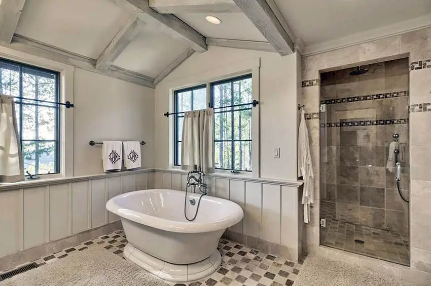 Bathroom with cathedral ceiling and checkered patterned floor