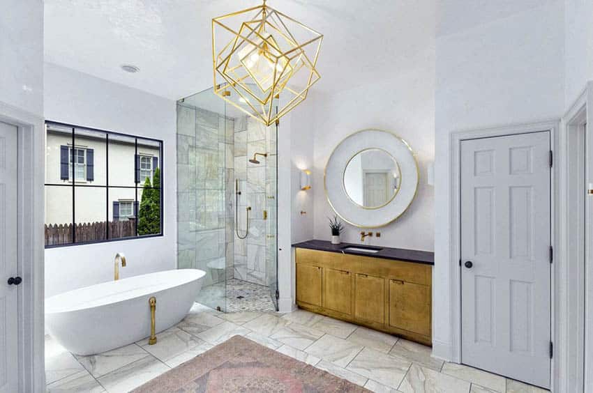 Bathroom with inset tiled shower and gold chandelier