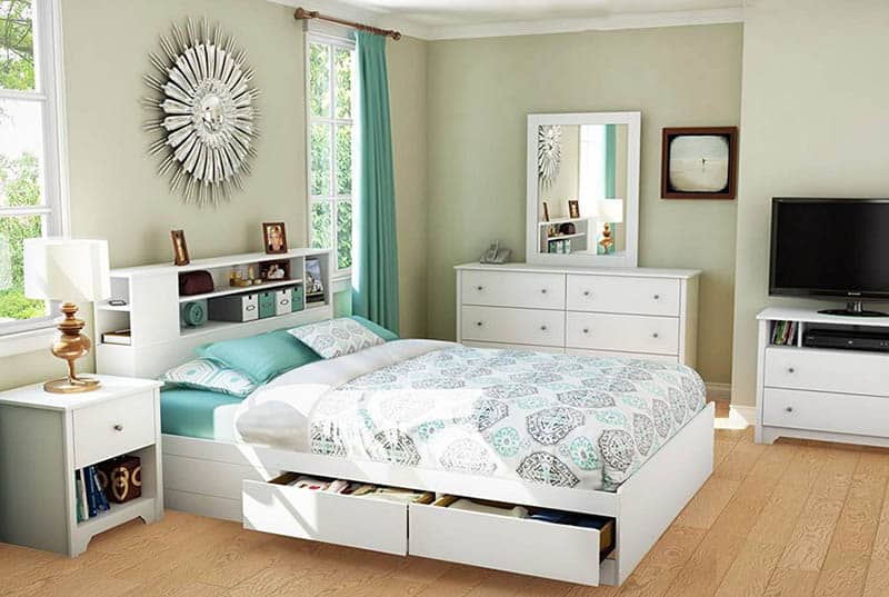 Bedroom with behind and under bed storage