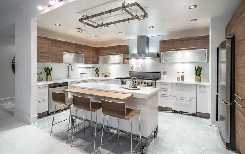 Contemporary kitchen with marble tile and white movable island