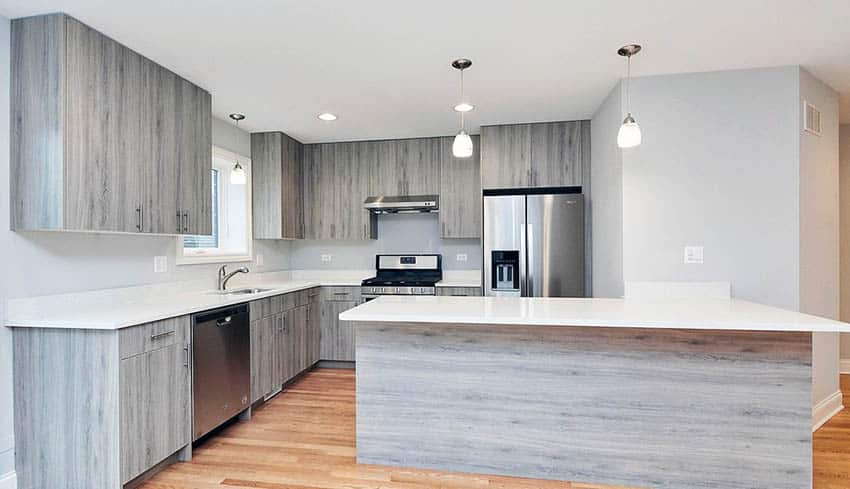 Contemporary kitchen with wood grain mdf cabinets and white quartz countertop
