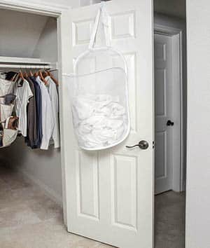 Hanging door hamper for clothing