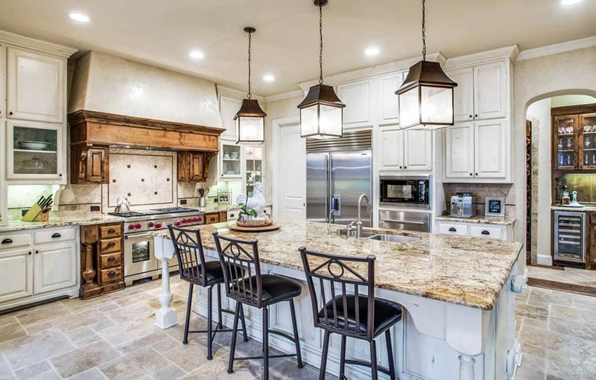 Kitchen with leaded cabinetry doors and solid wood range hood