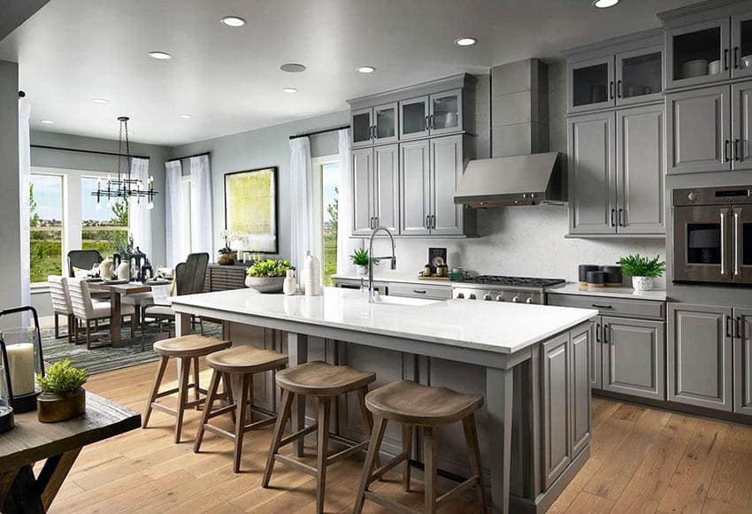 Kitchen with gray cabinets, engineered hardwood flooring and quartz top