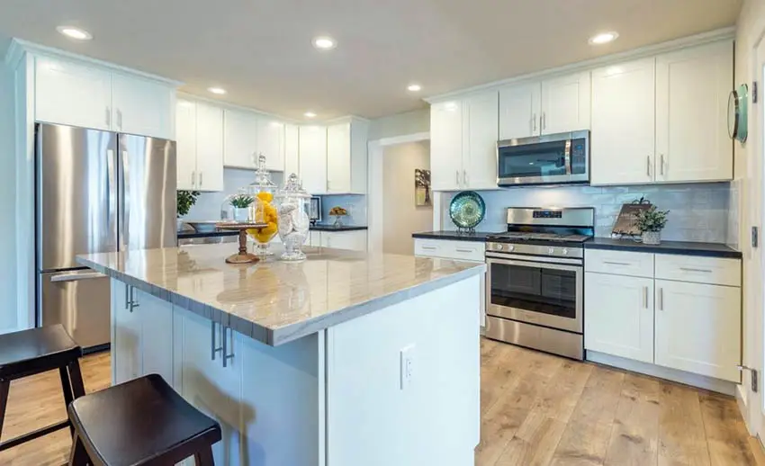 Kitchen With White Mdf Cabinets Quartz Countertop .webp