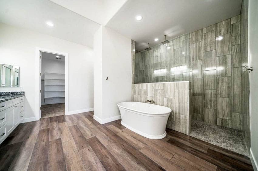 Half wall shower with tub in front