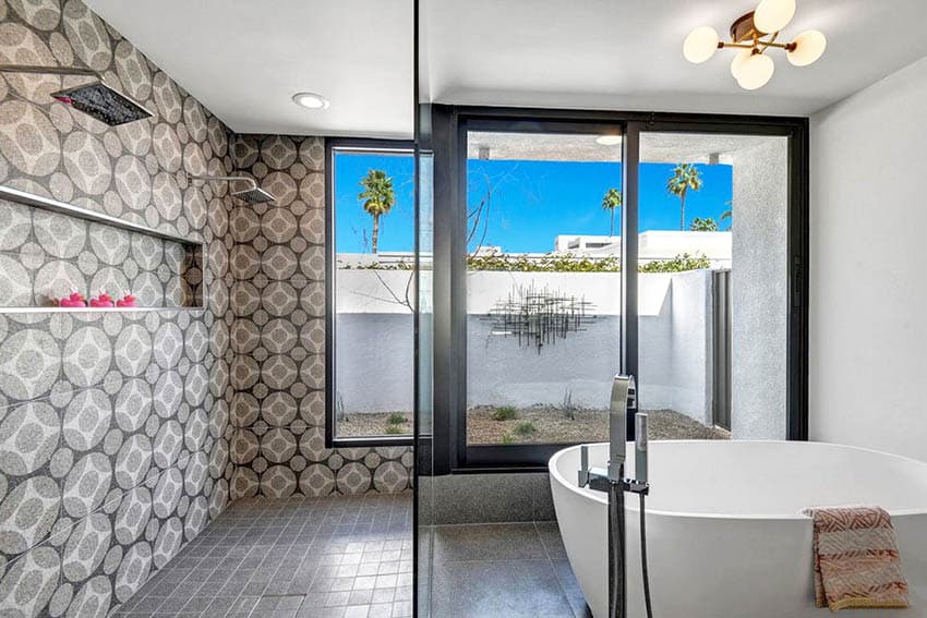 Large walk in shower design with two rainfall shower heads and mid century modern tile