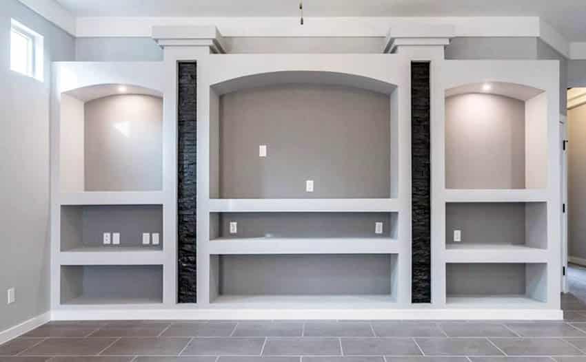 Room with lighting and arched open cabinets