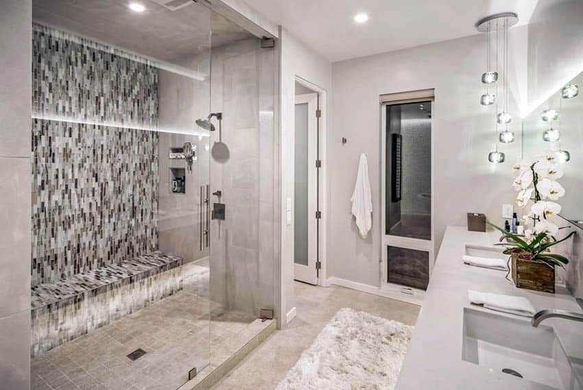 Master bathroom with mosaic tile walk in shower and bench