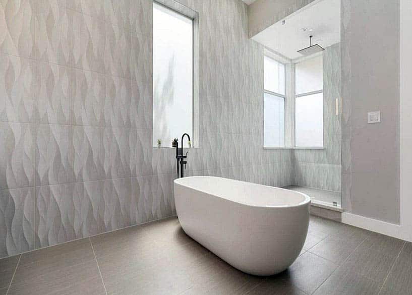 Modern bathroom with walk in shower and textured wall tile