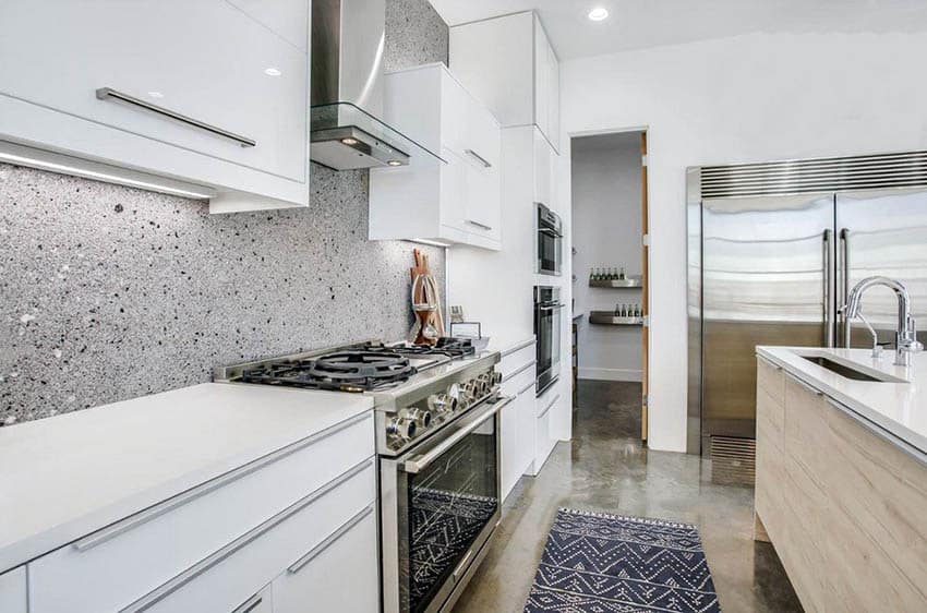 Modern kitchen with epoxy flooring, and wood grain island