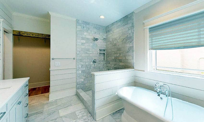 Open shower with shiplap divider and windows with blinds