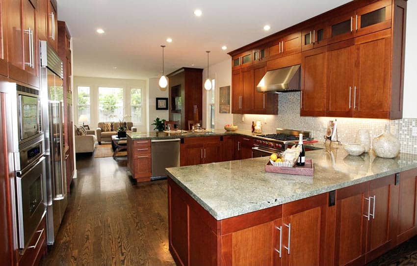 Traditional kitchen with cherry wood shaker style cabinets and quartz countertop