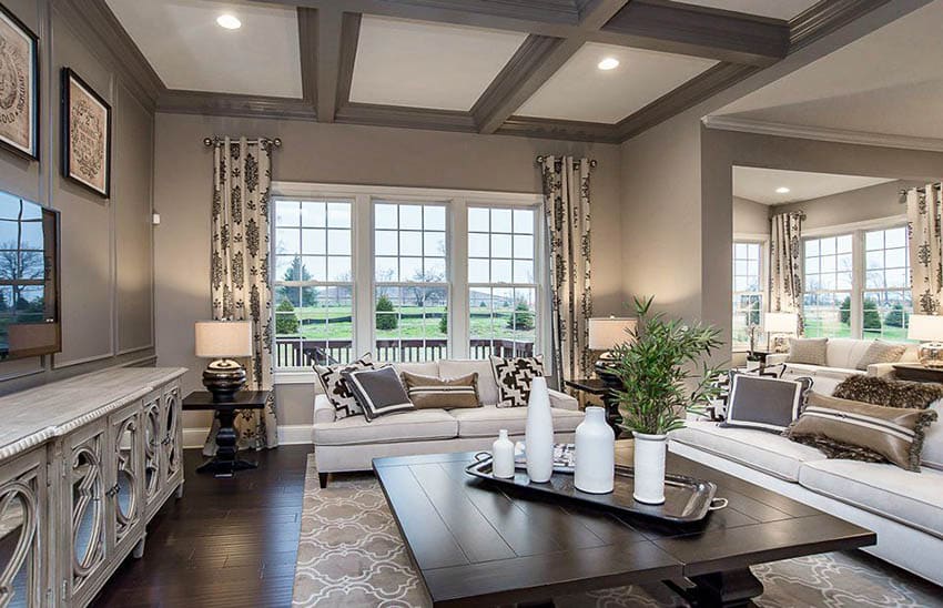 Living room with coffered ceiling and hand scraped wood flooring