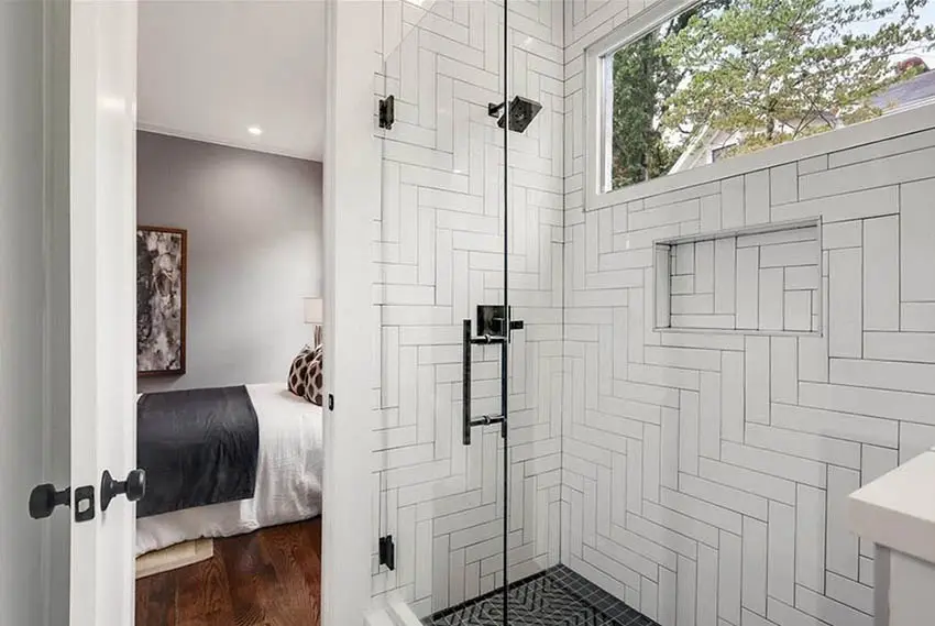 Shower with 90 degree herringbone pattern tiles for the walls